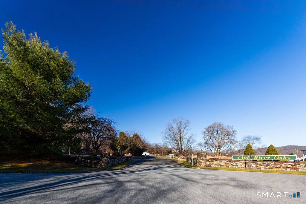 40 Long River Road Sherman, CT 06784 - Photo 18 of 24 a view of a town with floor to ceiling windows