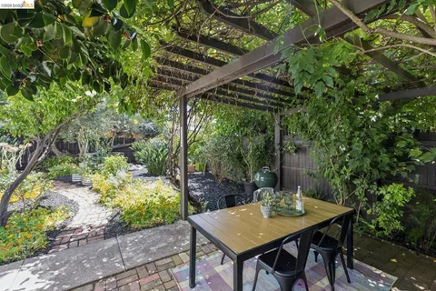 a view of a backyard with a table and chairs