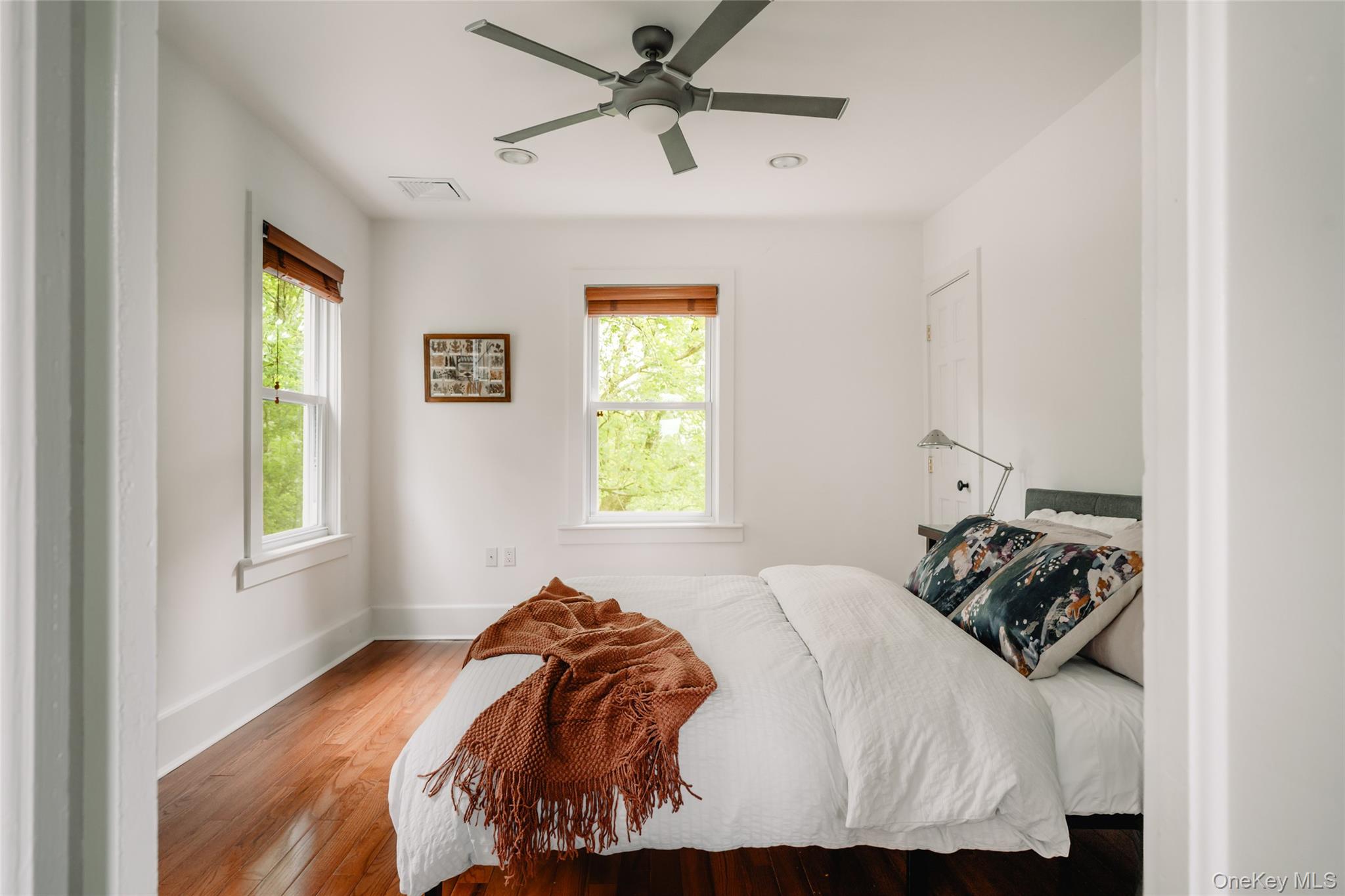 111 Jim Stephenson Road Jeffersonville, NY 12748 - Photo 19 of 50 a bedroom with a bed and a window