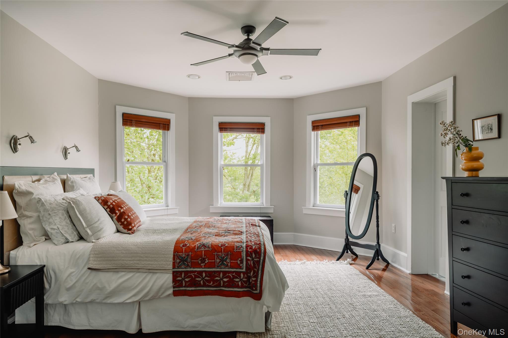 111 Jim Stephenson Road Jeffersonville, NY 12748 - Photo 20 of 50 a bedroom with a bed a table and windows