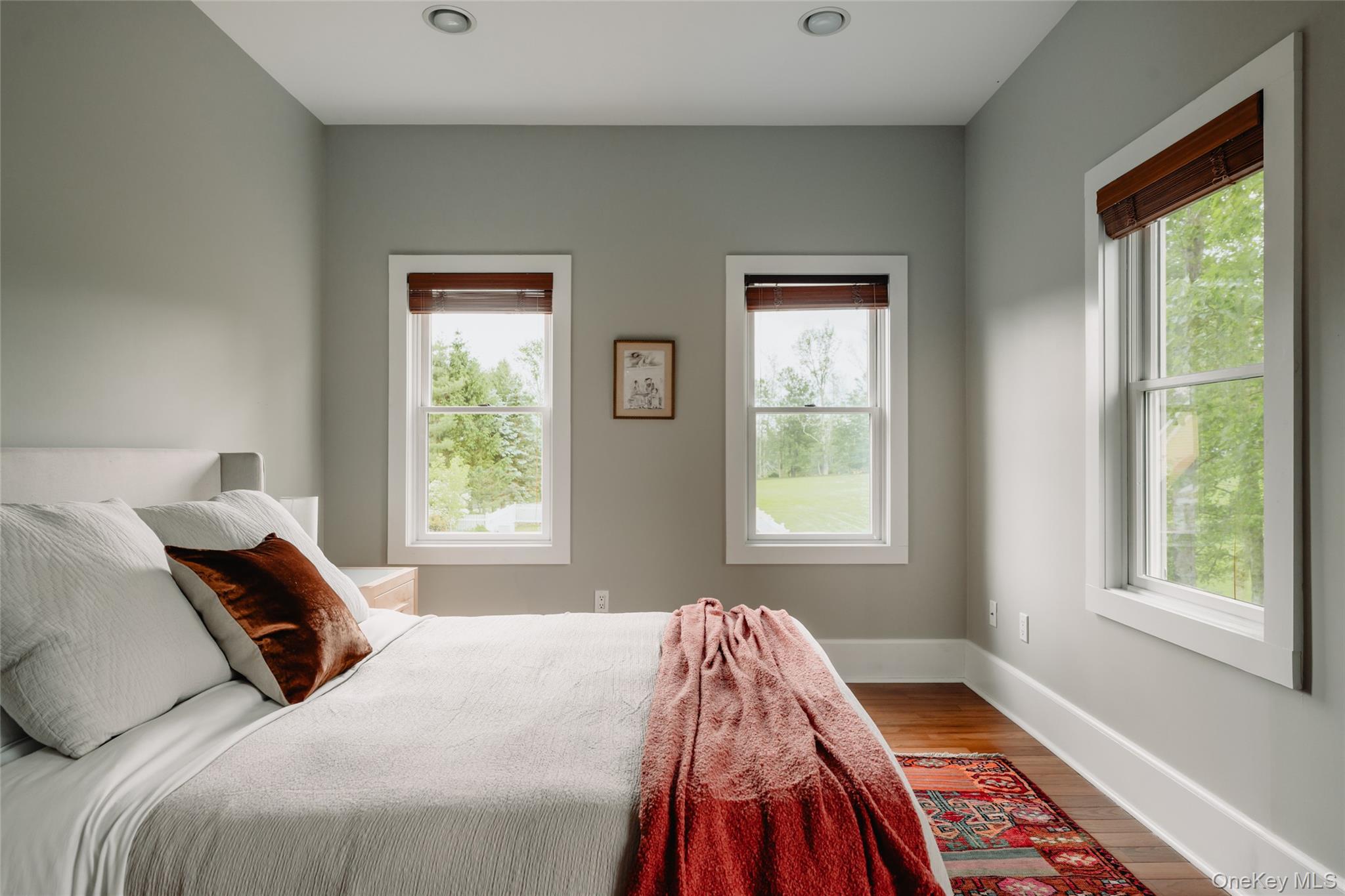 111 Jim Stephenson Road Jeffersonville, NY 12748 - Photo 23 of 50 a bedroom with a bed and a window