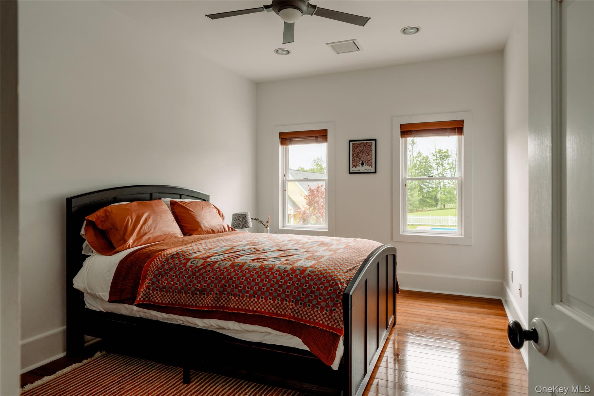 111 Jim Stephenson Road Jeffersonville, NY 12748 - Photo 25 of 50 a bedroom with a bed and a window