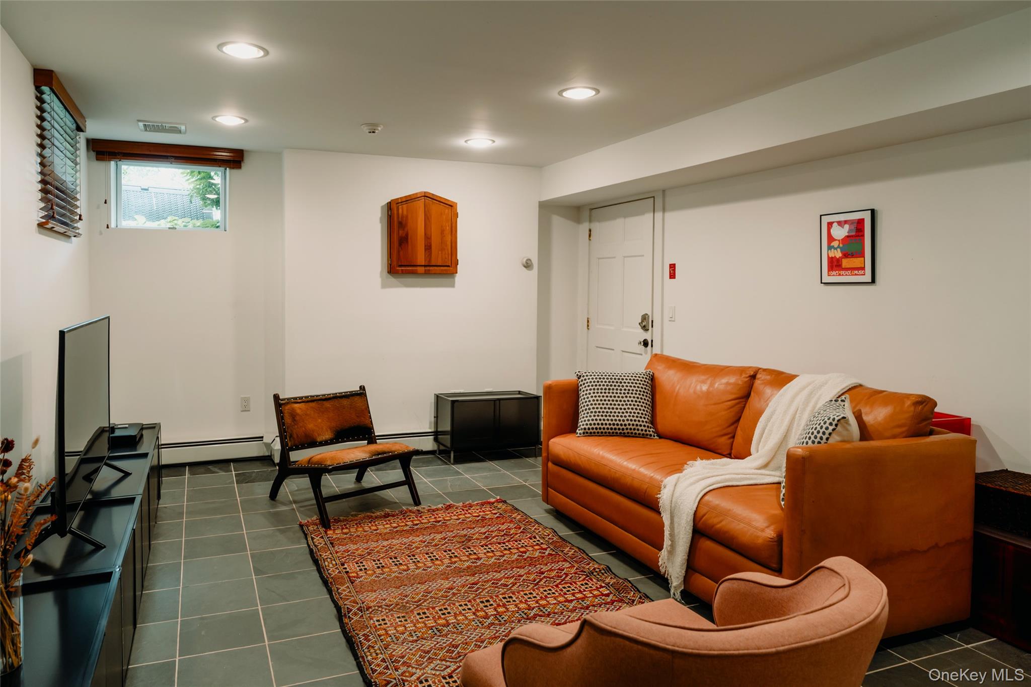 111 Jim Stephenson Road Jeffersonville, NY 12748 - Photo 28 of 50 a living room with furniture and a rug