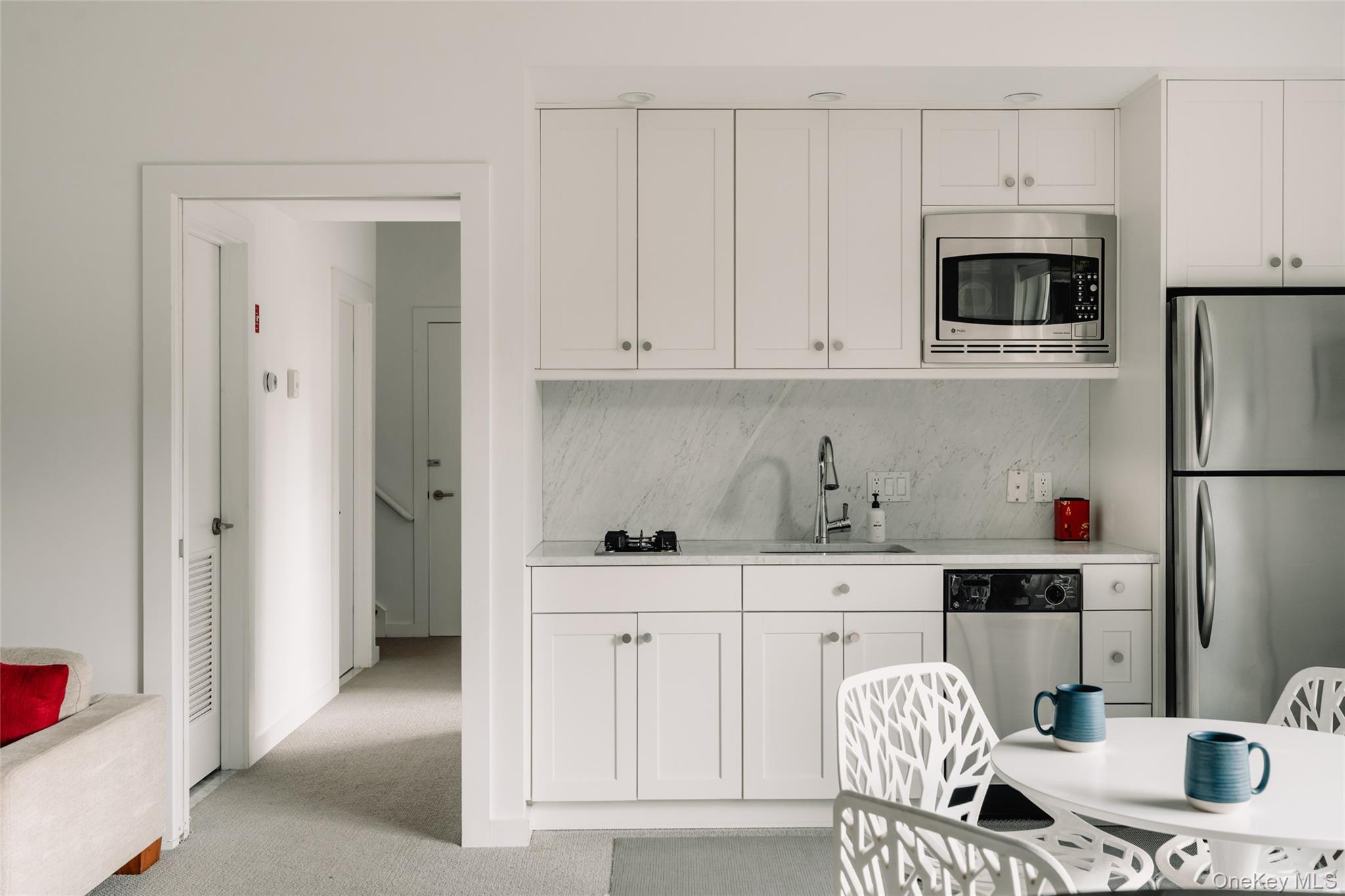 111 Jim Stephenson Road Jeffersonville, NY 12748 - Photo 39 of 50 a kitchen with stainless steel appliances granite countertop a refrigerator and a stove top oven