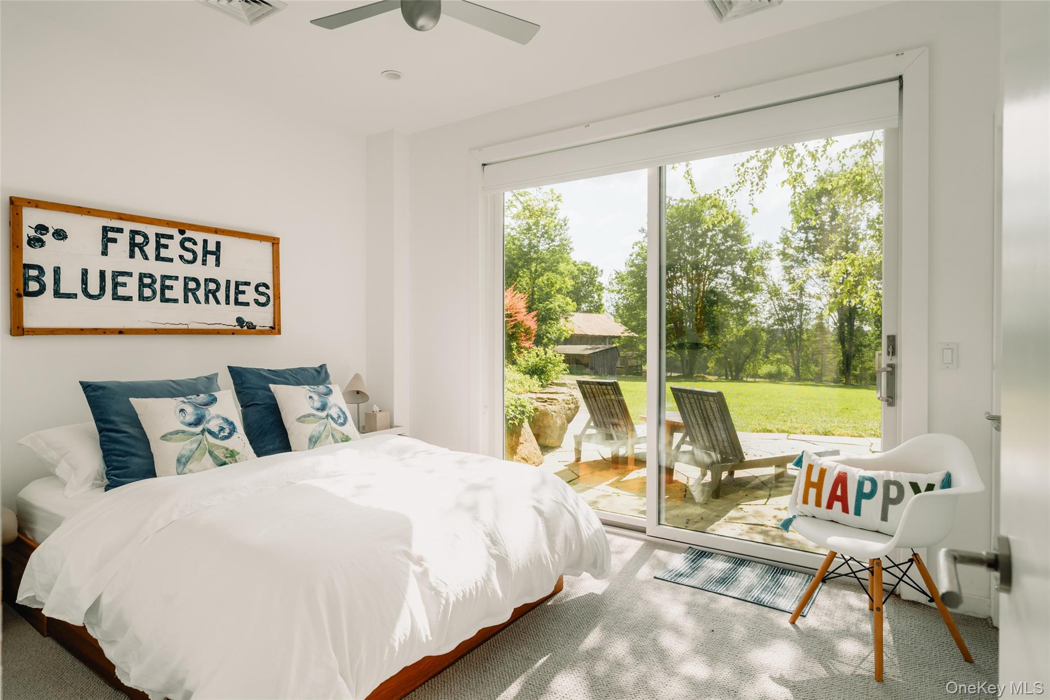 111 Jim Stephenson Road Jeffersonville, NY 12748 - Photo 40 of 50 a bedroom with a bed a large window with table and chairs