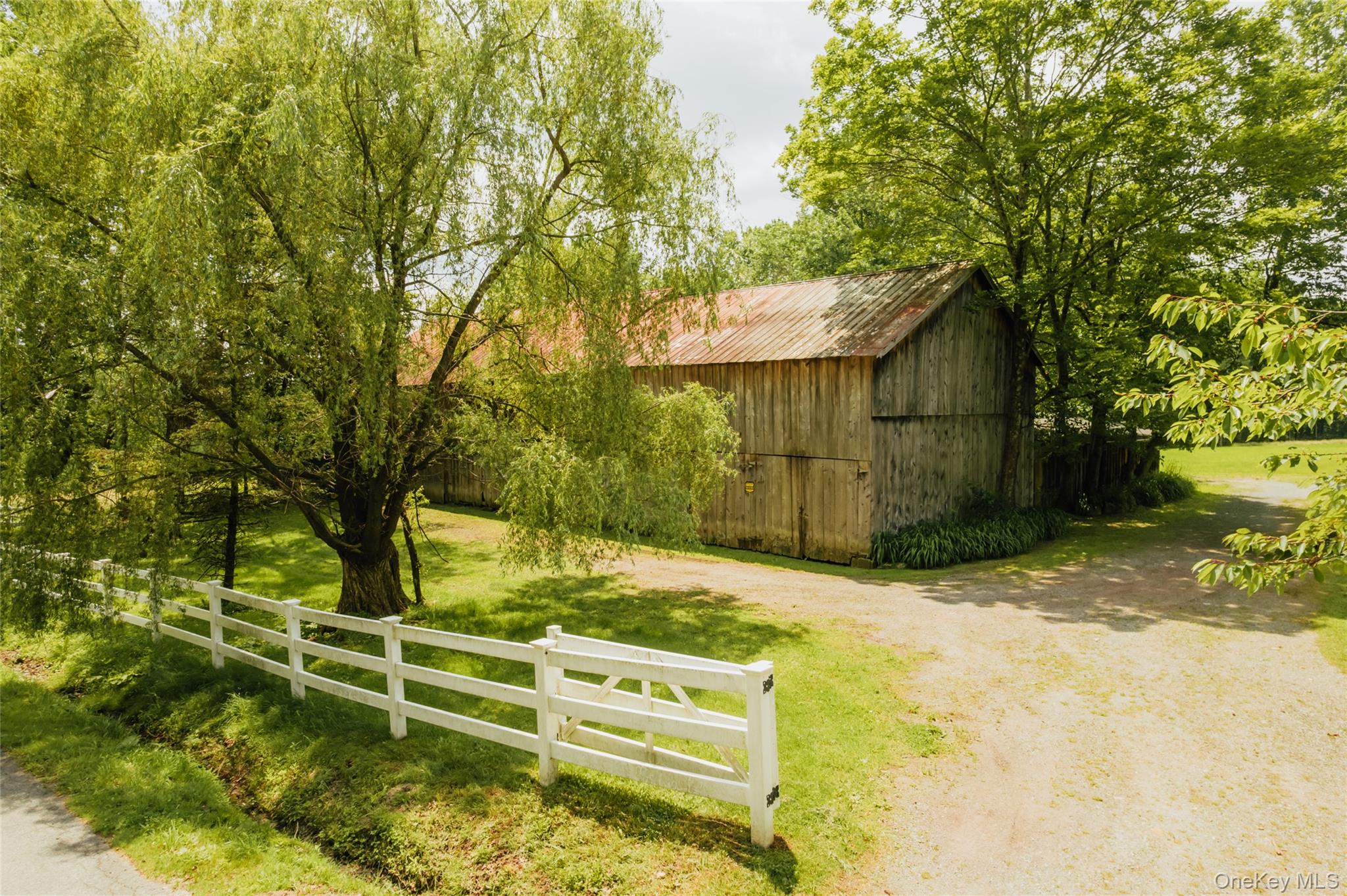 111 Jim Stephenson Road Jeffersonville, NY 12748 - Photo 45 of 50 a view of backyard with wooden fence and large trees