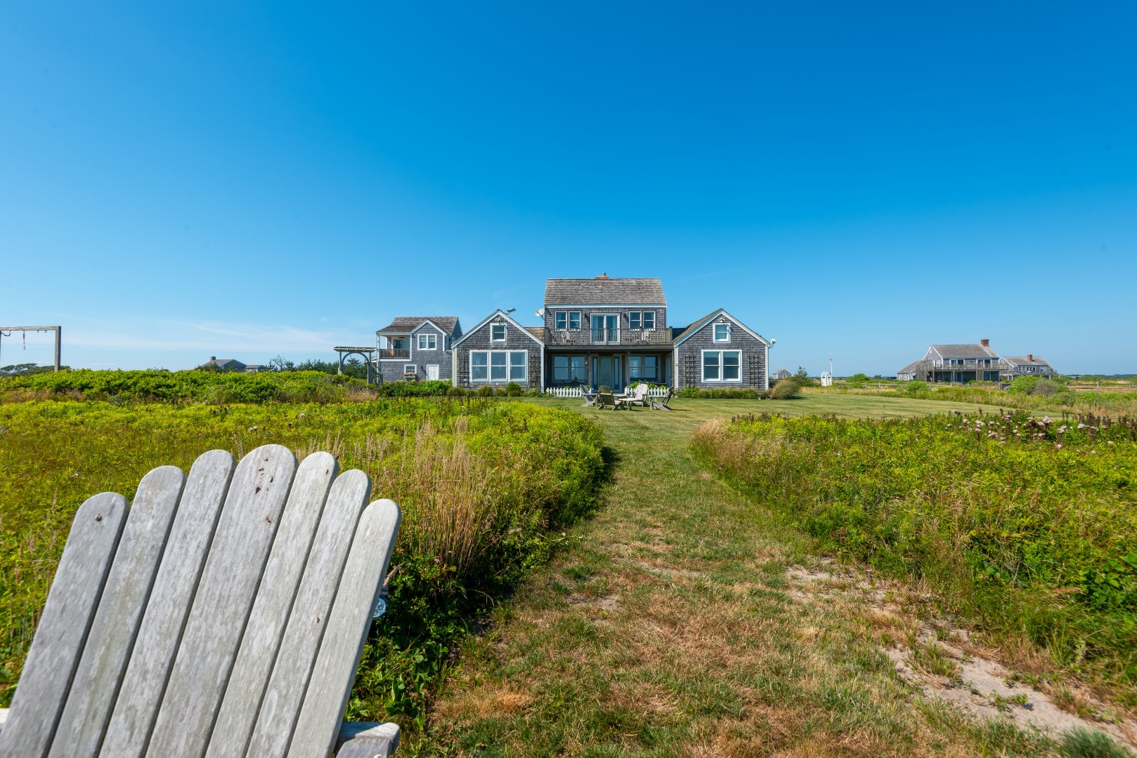 56 R Madequecham Valley Road Nantucket, MA 02554 - Photo 20 of 52 a view of a balcony with chairs