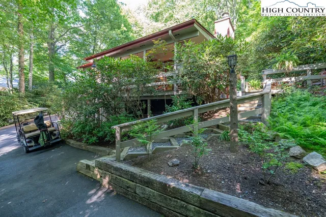 a view of backyard with furniture and a grill