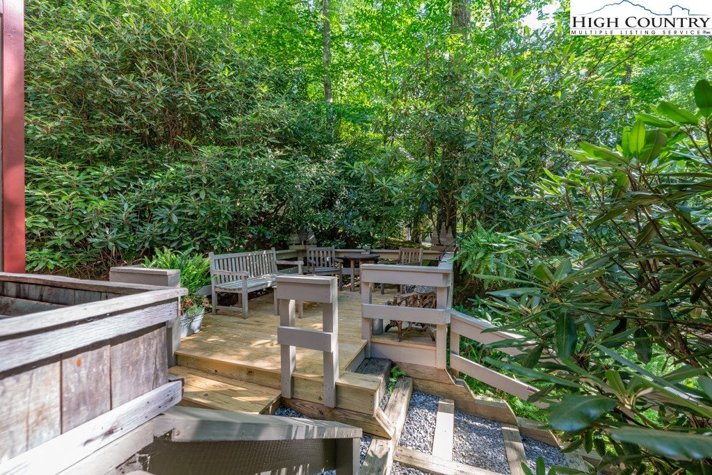 307 Lakeview Road Newland, NC 28657 - Photo 11 of 49 a view of a patio with table and chairs and potted plants
