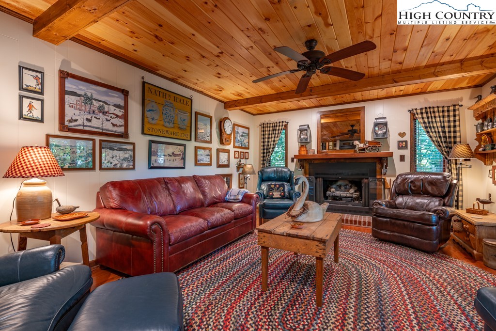 307 Lakeview Road Newland, NC 28657 - Photo 12 of 49 a living room with furniture a fireplace and a table