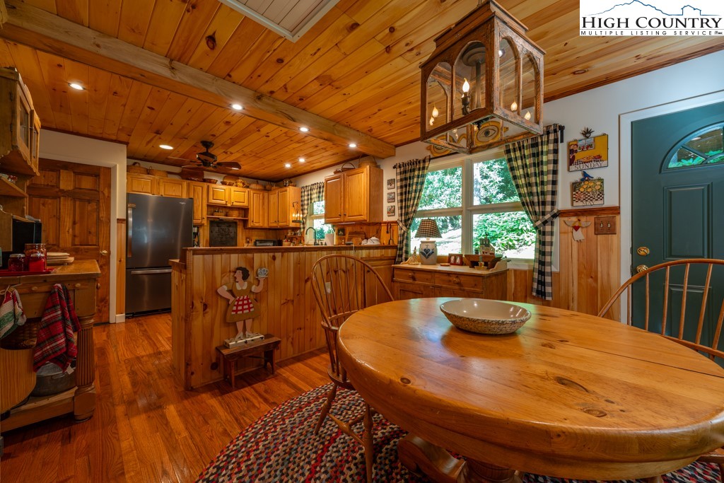 307 Lakeview Road Newland, NC 28657 - Photo 22 of 49 a view of a dining room with furniture window and outside view