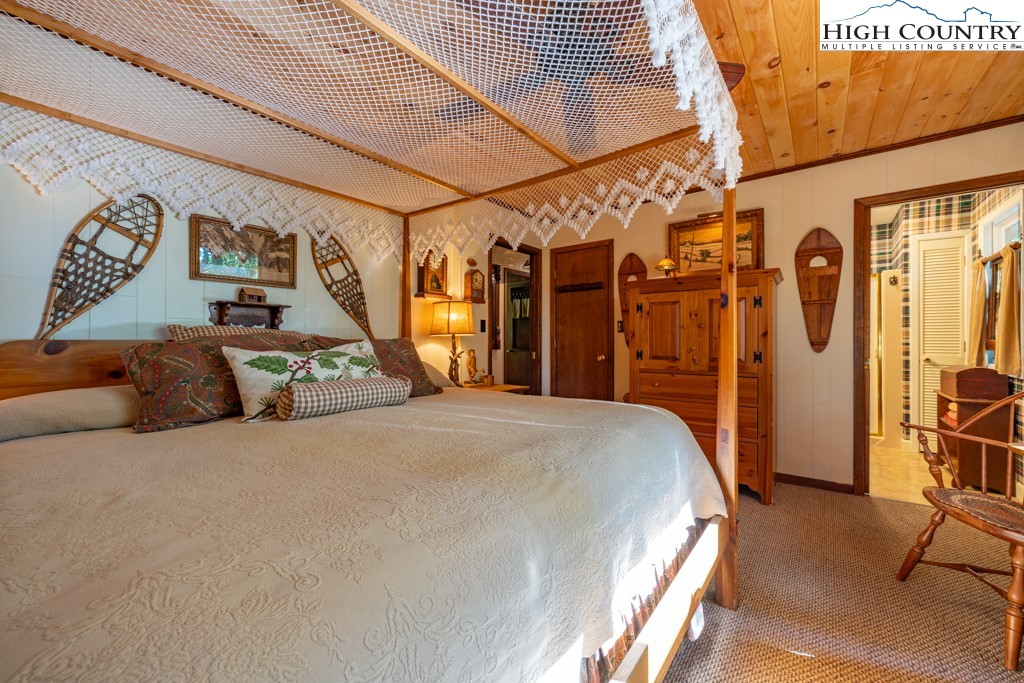 307 Lakeview Road Newland, NC 28657 - Photo 32 of 49 a bed room with a bed and a chair