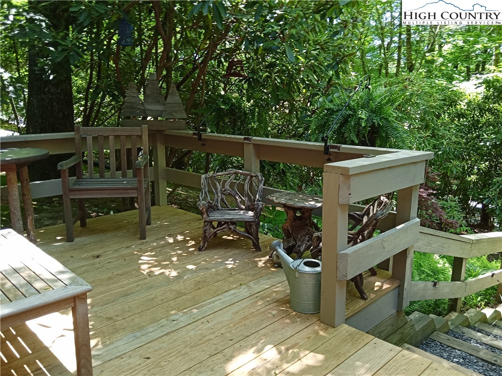 307 Lakeview Road Newland, NC 28657 - Photo 39 of 49 a view of a deck with chairs and wooden fence