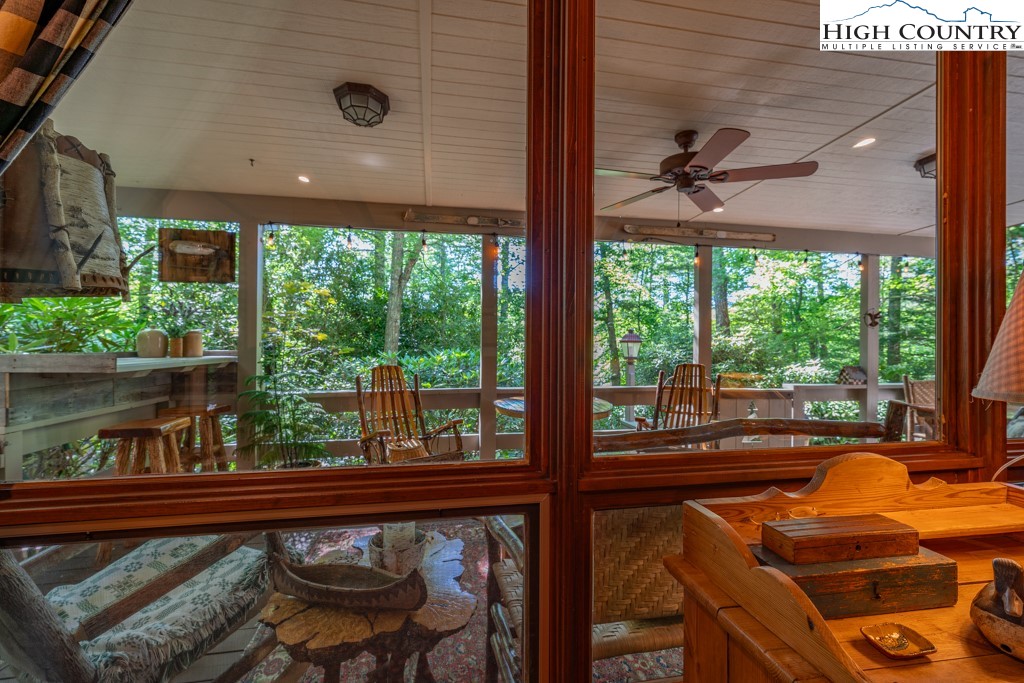 307 Lakeview Road Newland, NC 28657 - Photo 4 of 49 a view of a balcony with chair and wooden floor