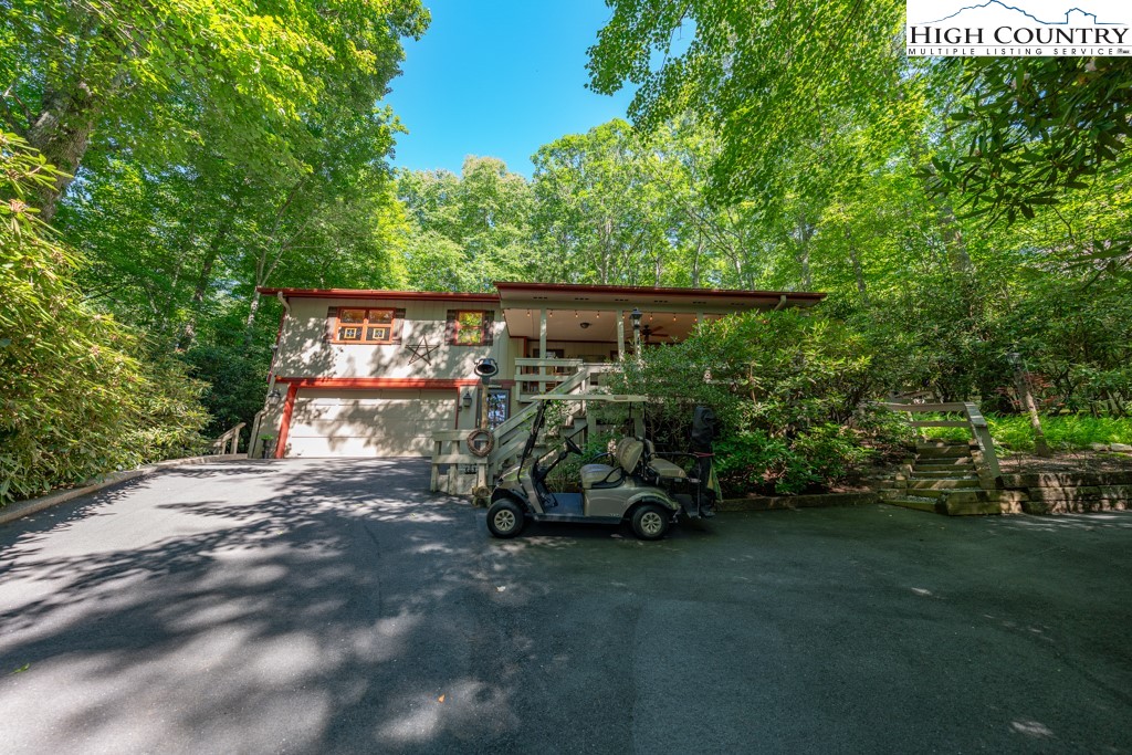 307 Lakeview Road Newland, NC 28657 - Photo 44 of 49 a small garden covered with tall trees