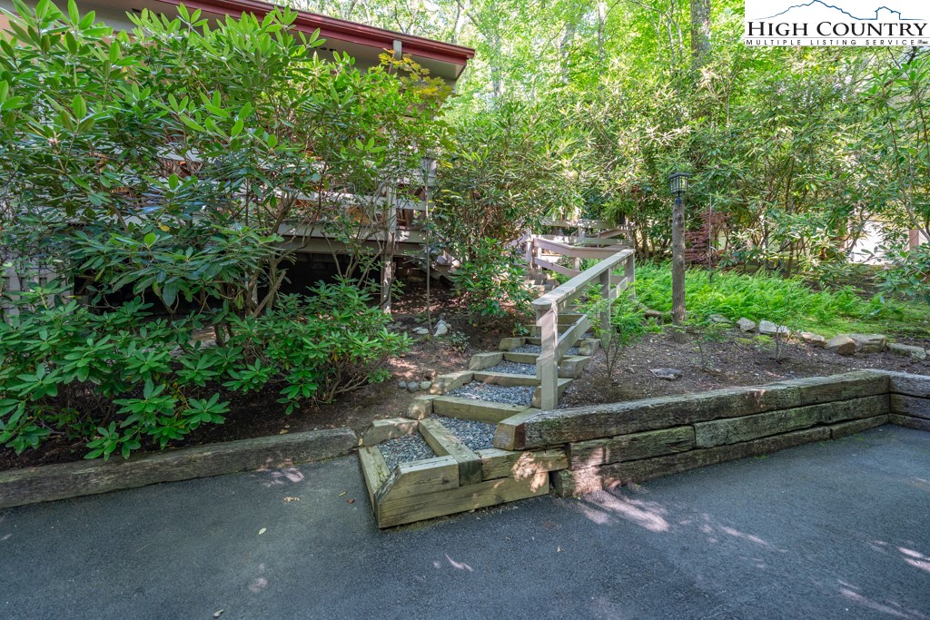 307 Lakeview Road Newland, NC 28657 - Photo 7 of 49 a view of backyard with outdoor seating and trees
