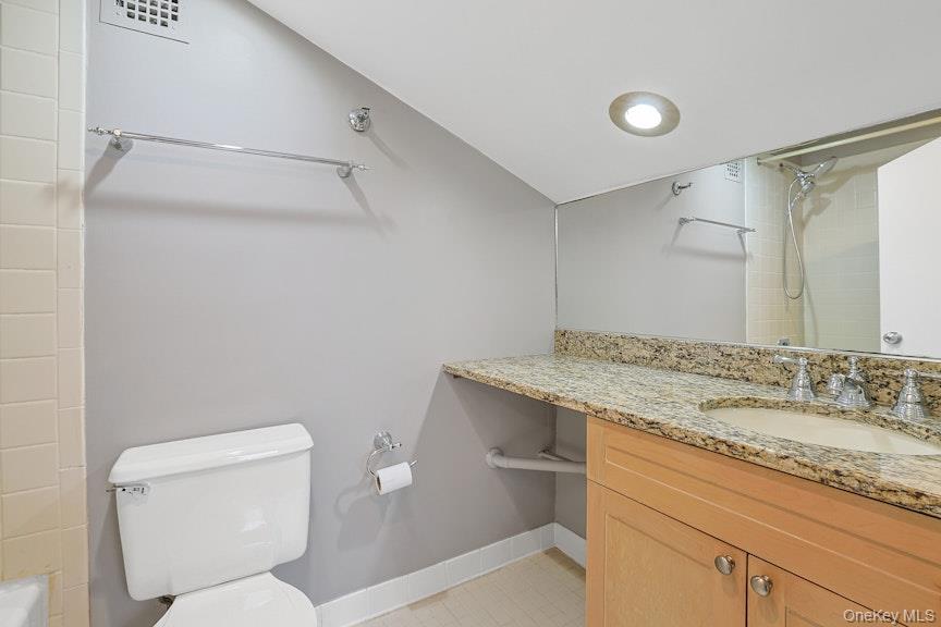 1701 Crompond Road, Unit 6304 Peekskill, NY 10566 - Photo 12 of 23 a bathroom with a granite countertop sink toilet and shower