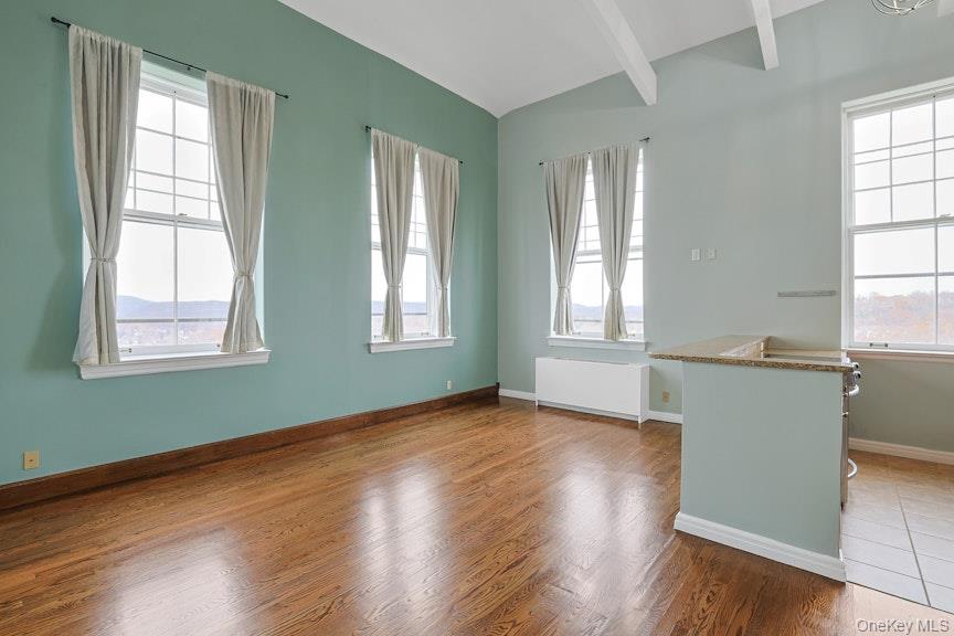 1701 Crompond Road, Unit 6304 Peekskill, NY 10566 - Photo 14 of 23 an empty room with wooden floor and windows
