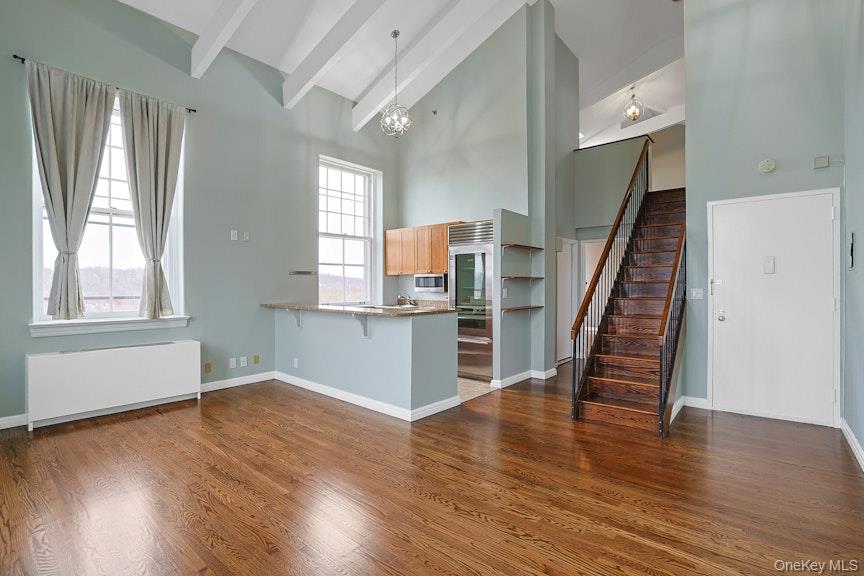 1701 Crompond Road, Unit 6304 Peekskill, NY 10566 - Photo 15 of 23 wooden floor in an empty room with a window and wooden floor