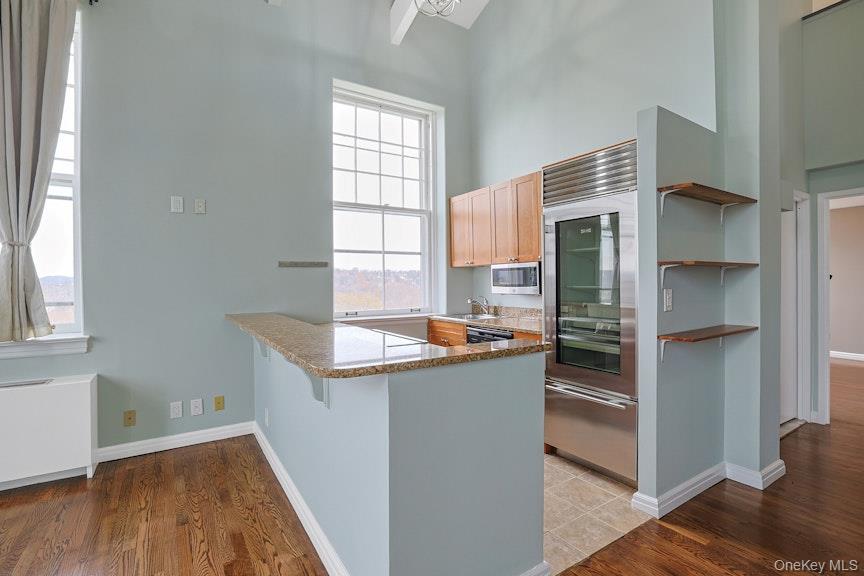 1701 Crompond Road, Unit 6304 Peekskill, NY 10566 - Photo 18 of 23 a kitchen with stainless steel appliances granite countertop a refrigerator and a sink