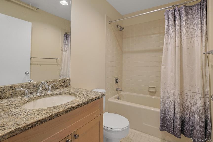 1701 Crompond Road, Unit 6304 Peekskill, NY 10566 - Photo 7 of 23 a bathroom with a granite countertop sink toilet and shower