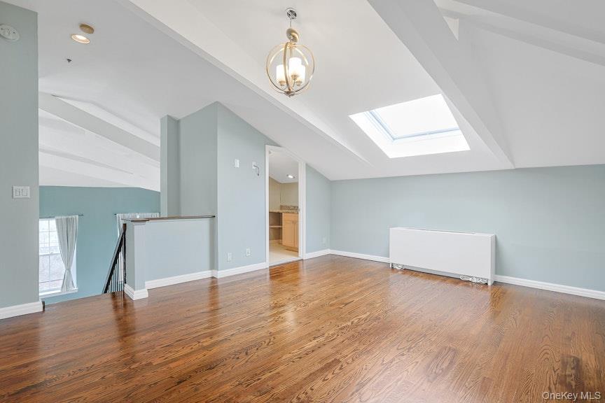 1701 Crompond Road, Unit 6304 Peekskill, NY 10566 - Photo 9 of 23 an empty room with wooden floor and windows