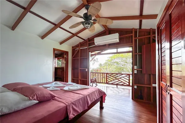 a bed room with a bed and a chair