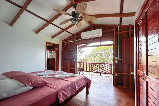 a bed room with a bed and a chair