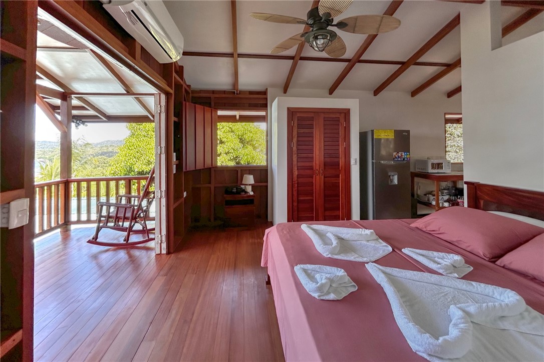 0 Drake Bay Costa Rica Out Of Area, OS 00000 - Photo 24 of 36 a bed room with a bed and a chair