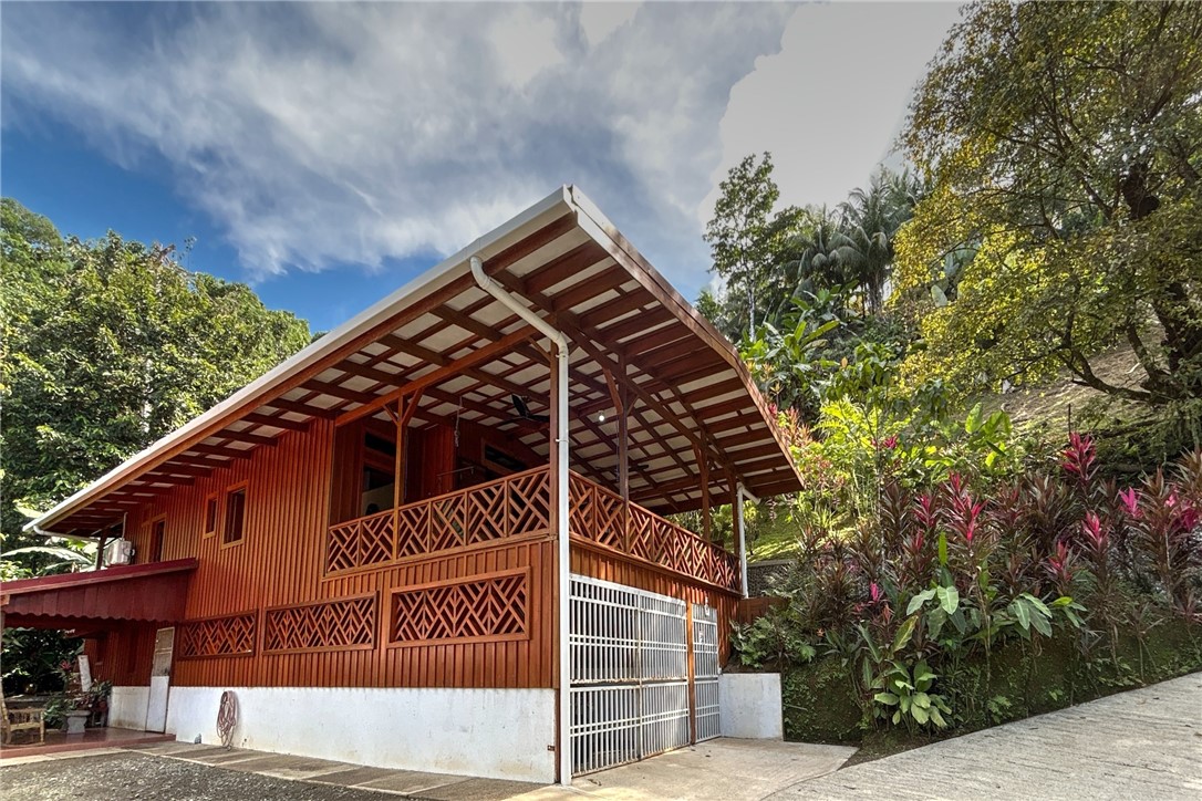 0 Drake Bay Costa Rica Out Of Area, OS 00000 - Photo 30 of 36 a front view of a house with a tree