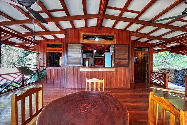 a view of a chairs and table in the patio