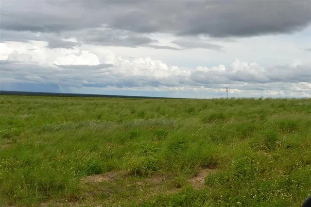 a view of an outdoor space and tennis court