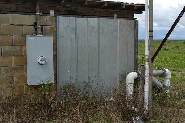 a view of a big yard and an ocean view