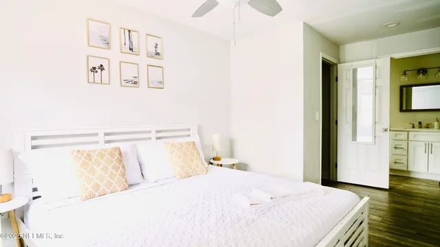 a bedroom with a bed and a tv