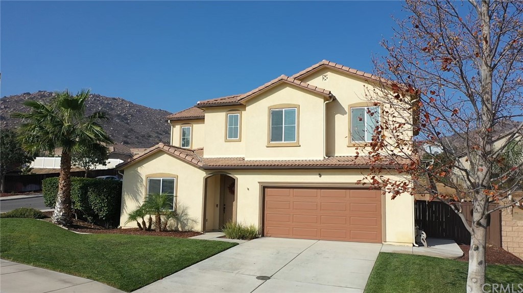 12179 Dewar Drive Riverside, CA 92505 - Photo 1 of 28 a front view of a house with a yard