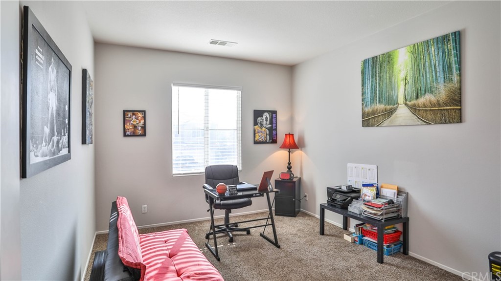 12179 Dewar Drive Riverside, CA 92505 - Photo 19 of 28 a living room with furniture and a chair