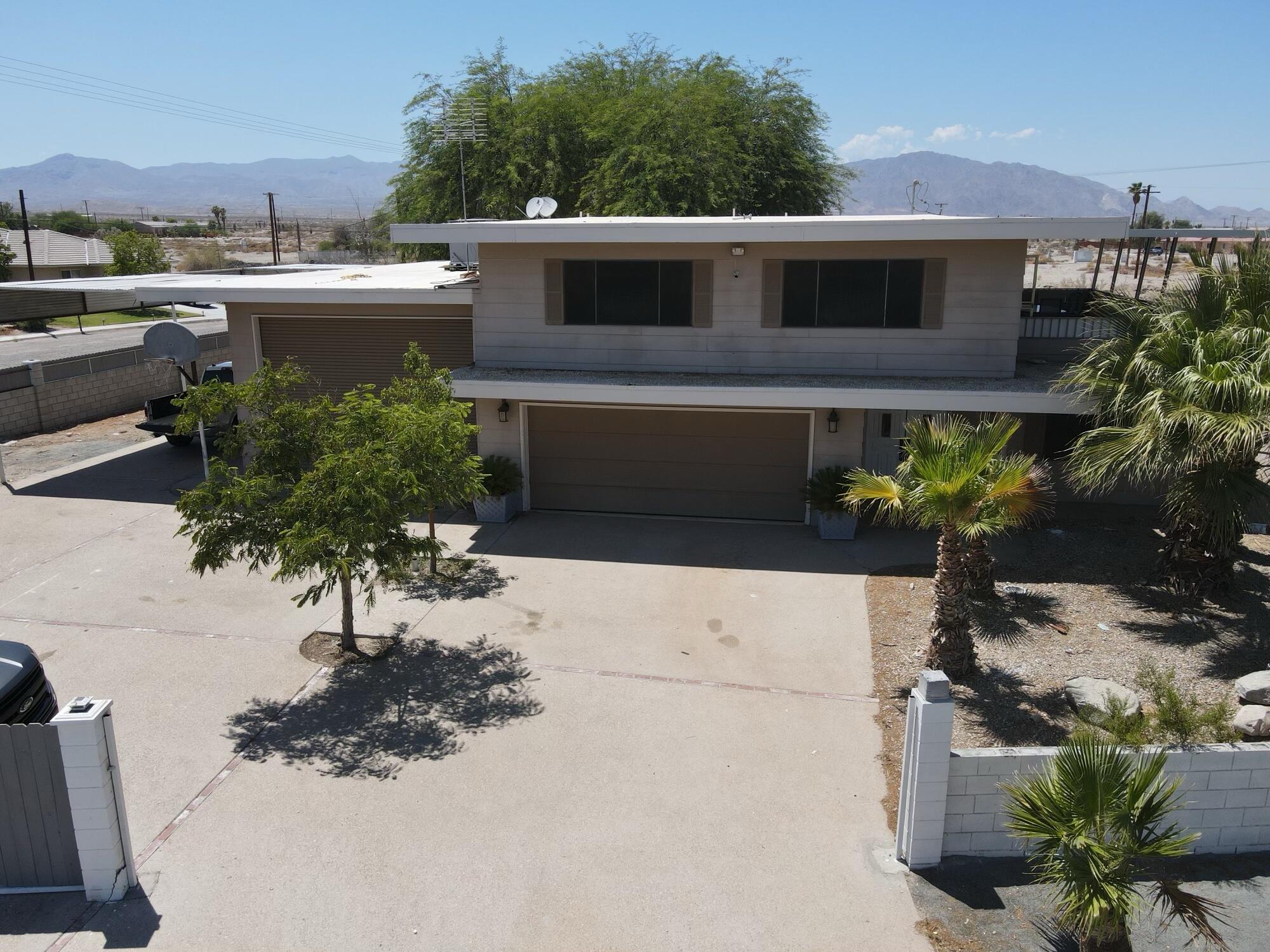 1498 Nile Drive Thermal, CA 92274 - Photo 12 of 108 a front view of a house with a yard