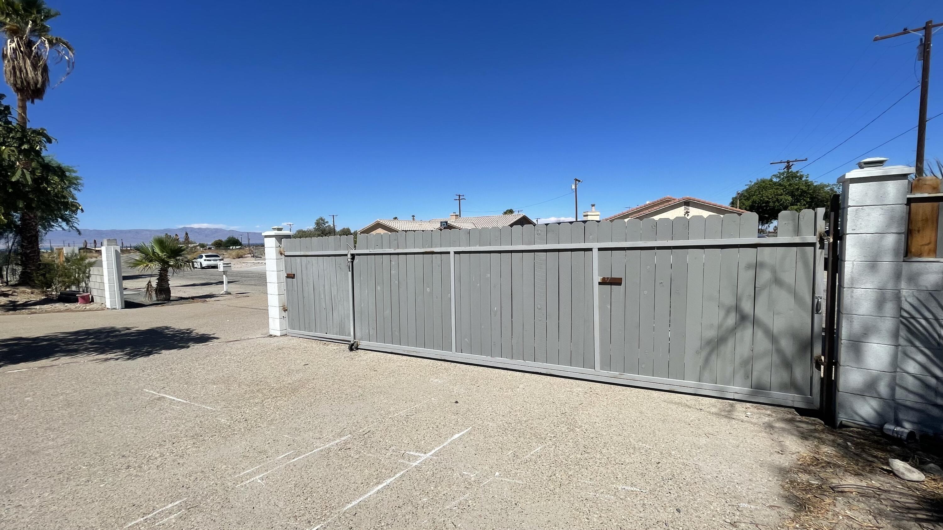 1498 Nile Drive Thermal, CA 92274 - Photo 19 of 108 a view of a road with a building in the background