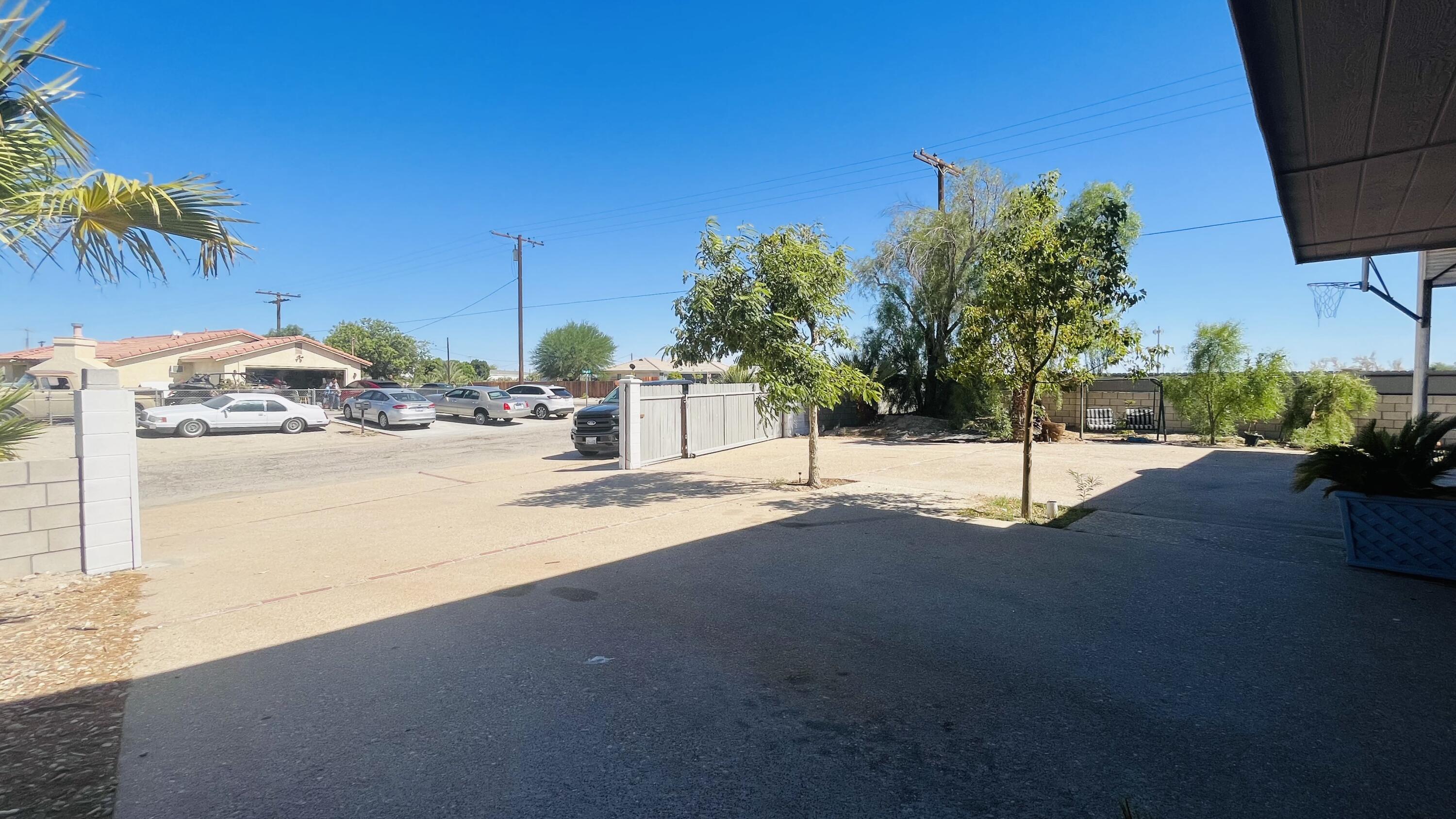 1498 Nile Drive Thermal, CA 92274 - Photo 20 of 108 a street view with wooden fence