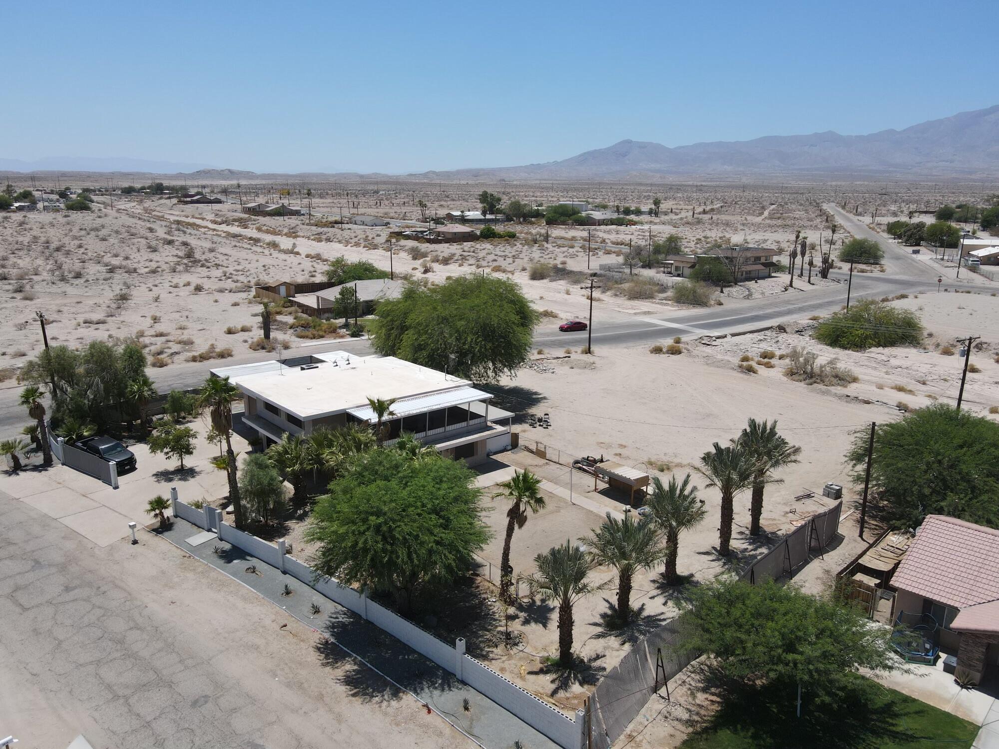 1498 Nile Drive Thermal, CA 92274 - Photo 3 of 108 an aerial view of a house with a yard and lake view