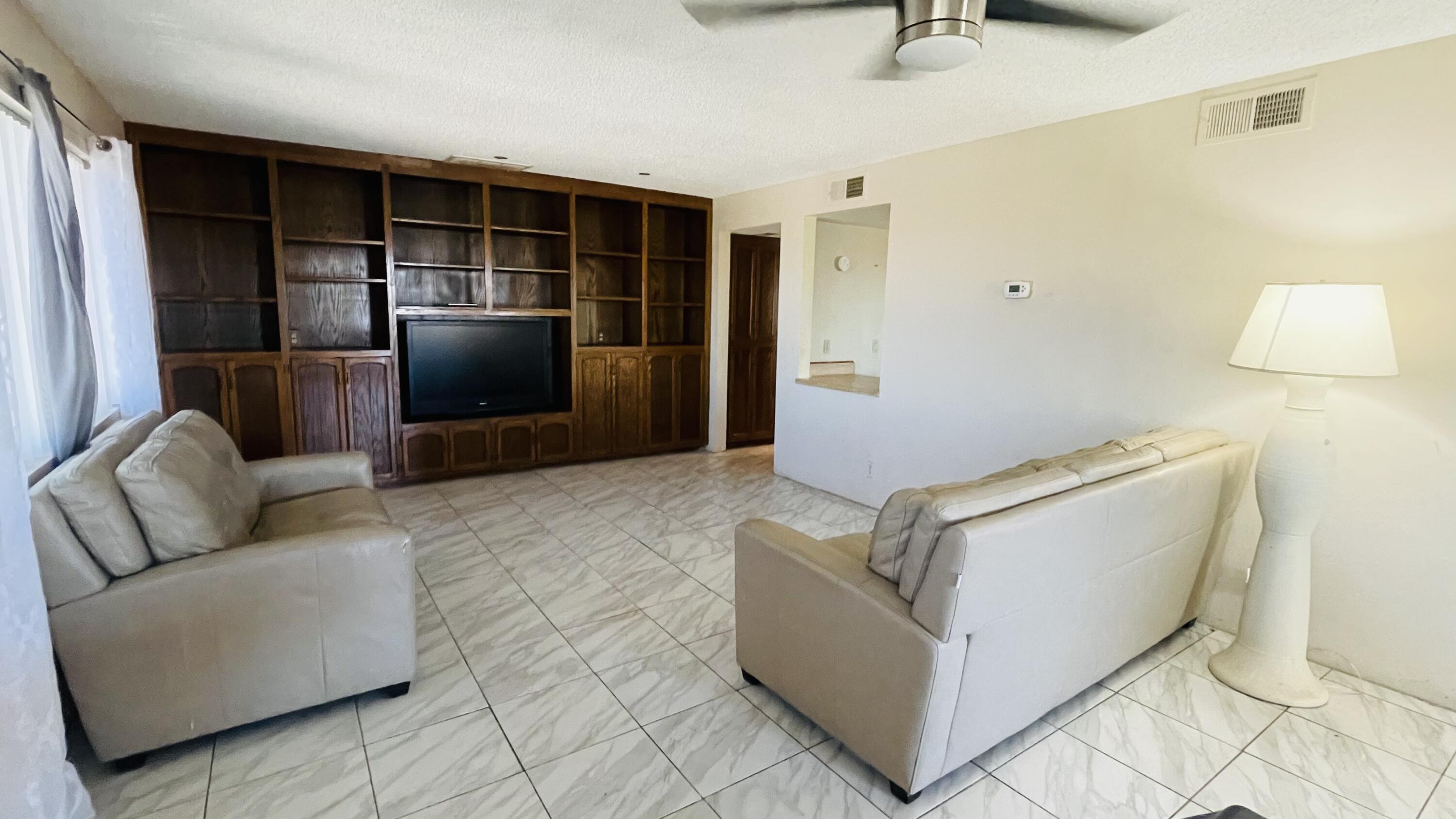 1498 Nile Drive Thermal, CA 92274 - Photo 31 of 108 a living room with furniture and a flat screen tv