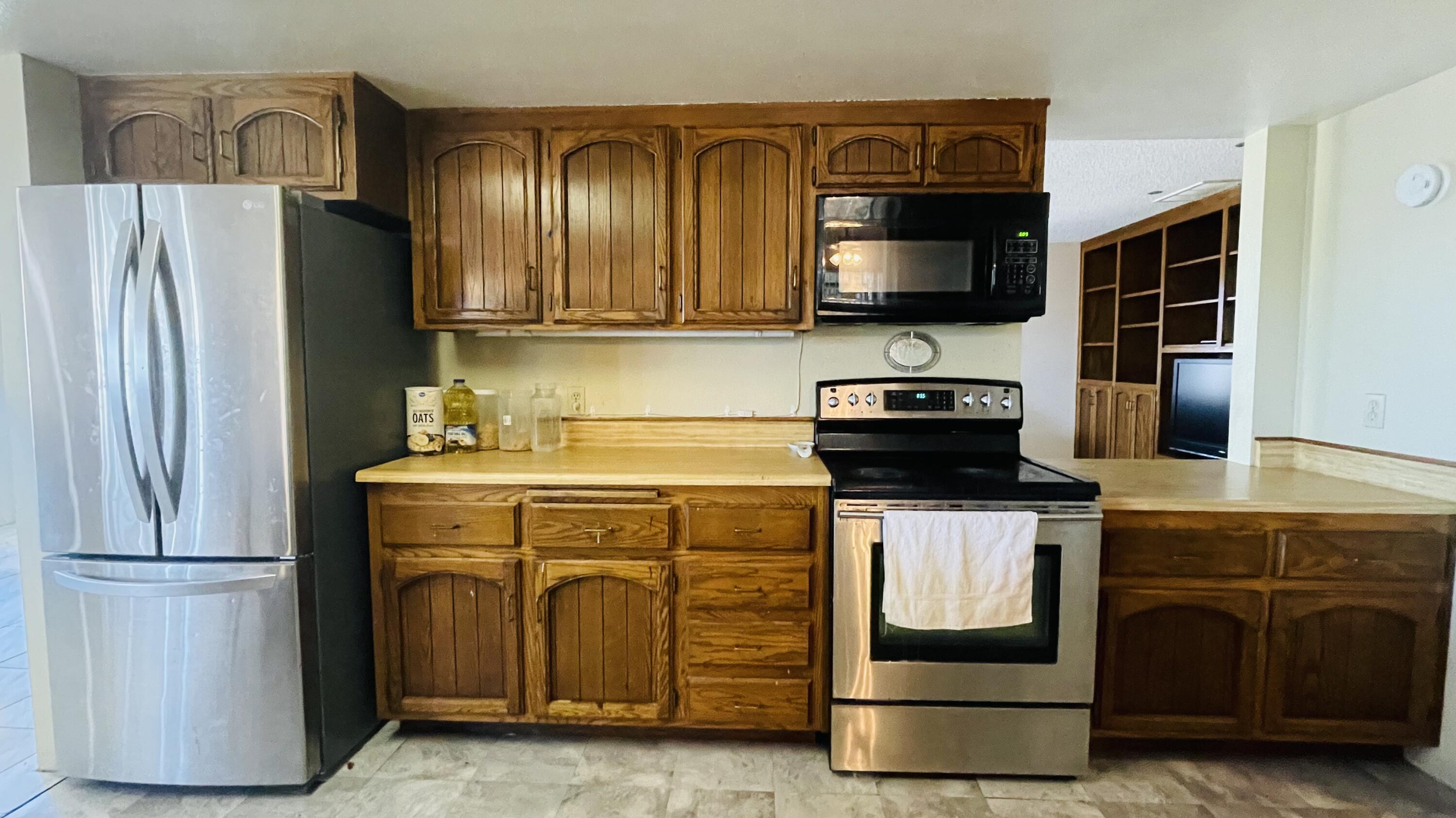 1498 Nile Drive Thermal, CA 92274 - Photo 32 of 108 a kitchen with stainless steel appliances granite countertop a refrigerator and a stove