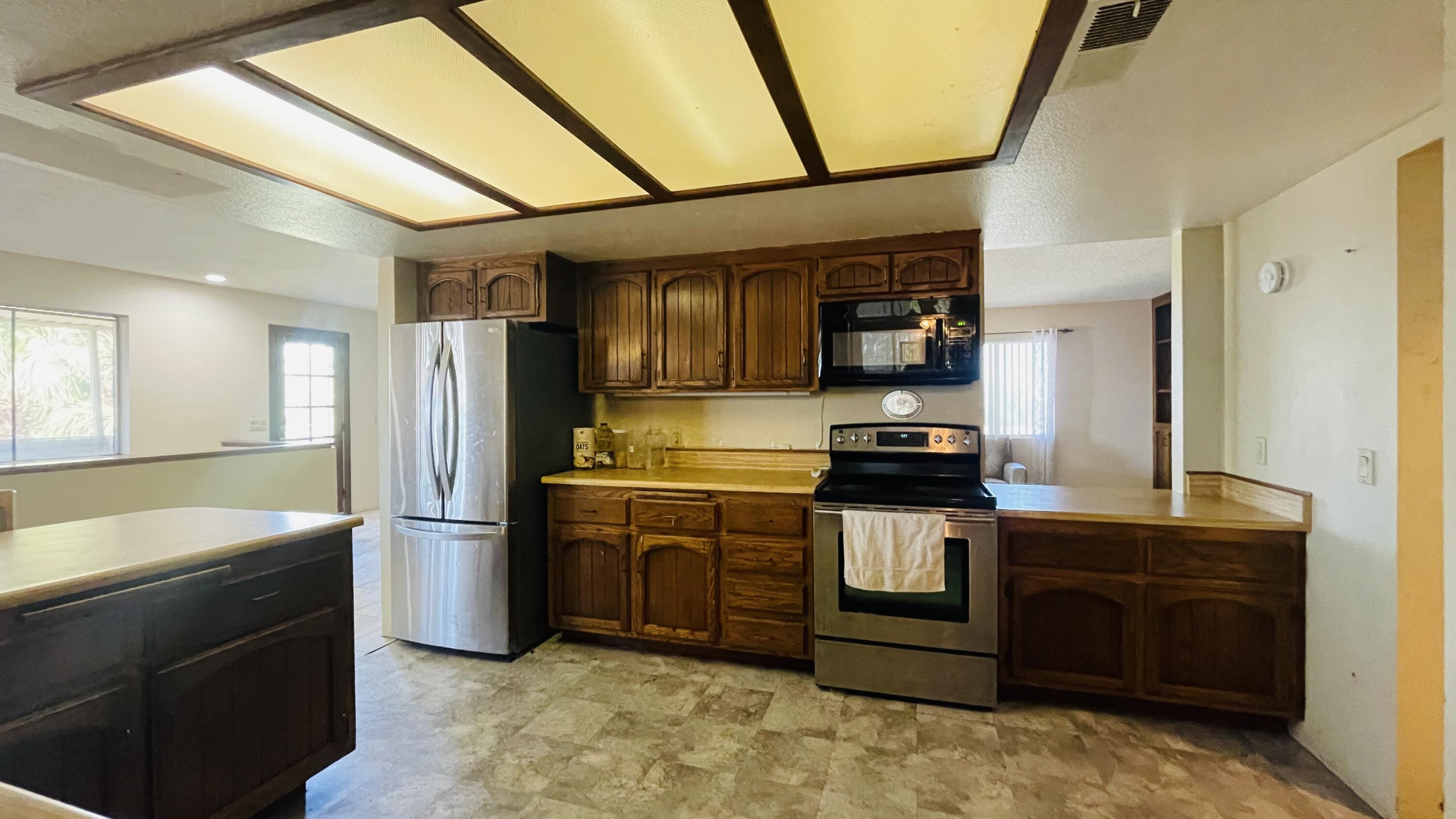 1498 Nile Drive Thermal, CA 92274 - Photo 34 of 108 a kitchen with stainless steel appliances granite countertop a refrigerator a stove and a sink