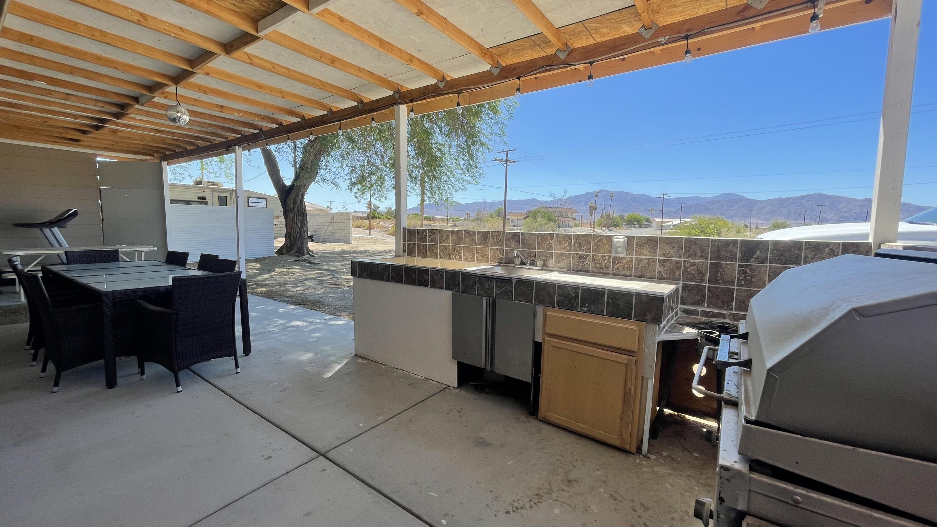 1498 Nile Drive Thermal, CA 92274 - Photo 40 of 108 a view of a chairs and table in a patio