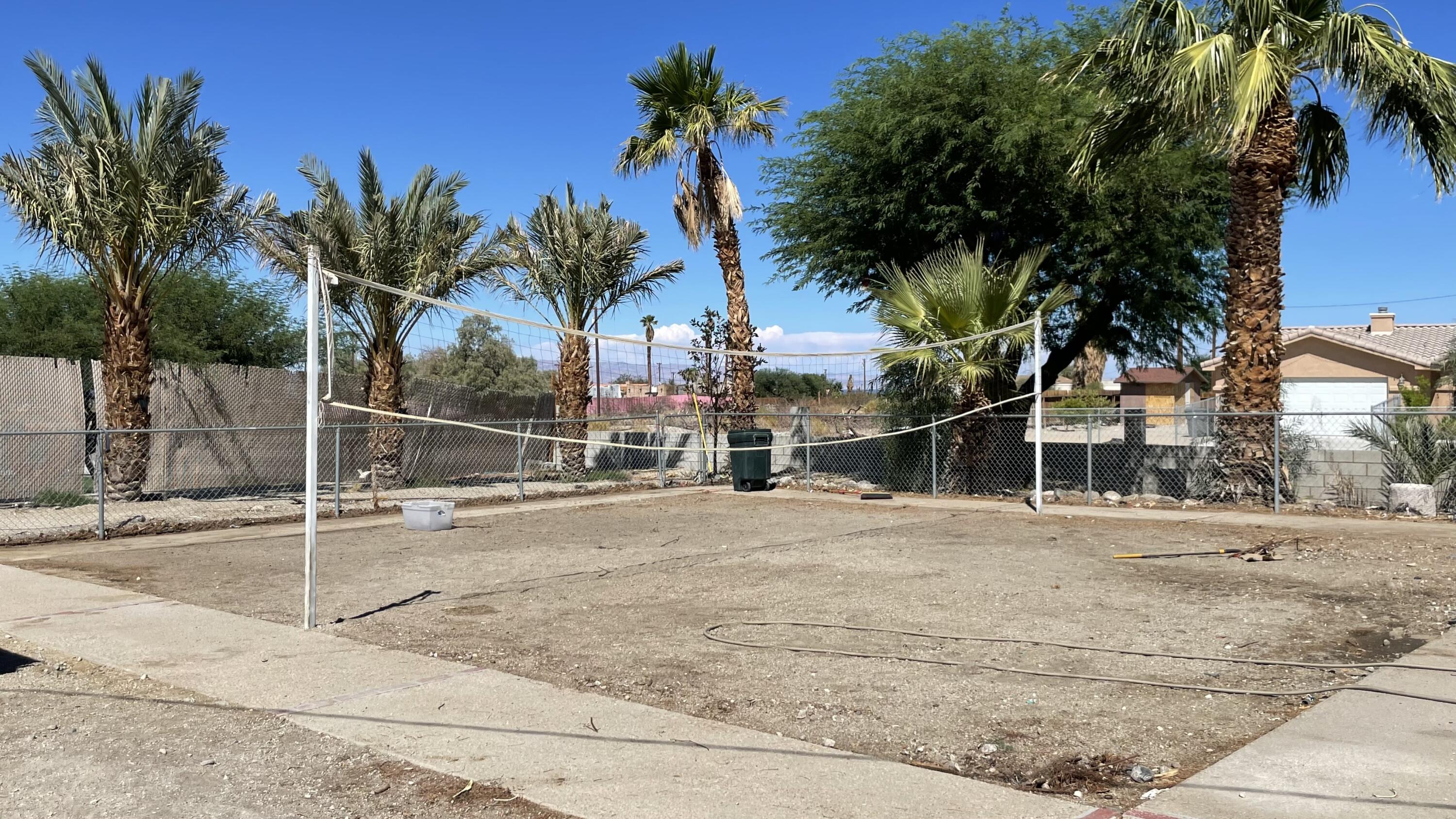 1498 Nile Drive Thermal, CA 92274 - Photo 46 of 108 a view of a house with a yard and palm trees