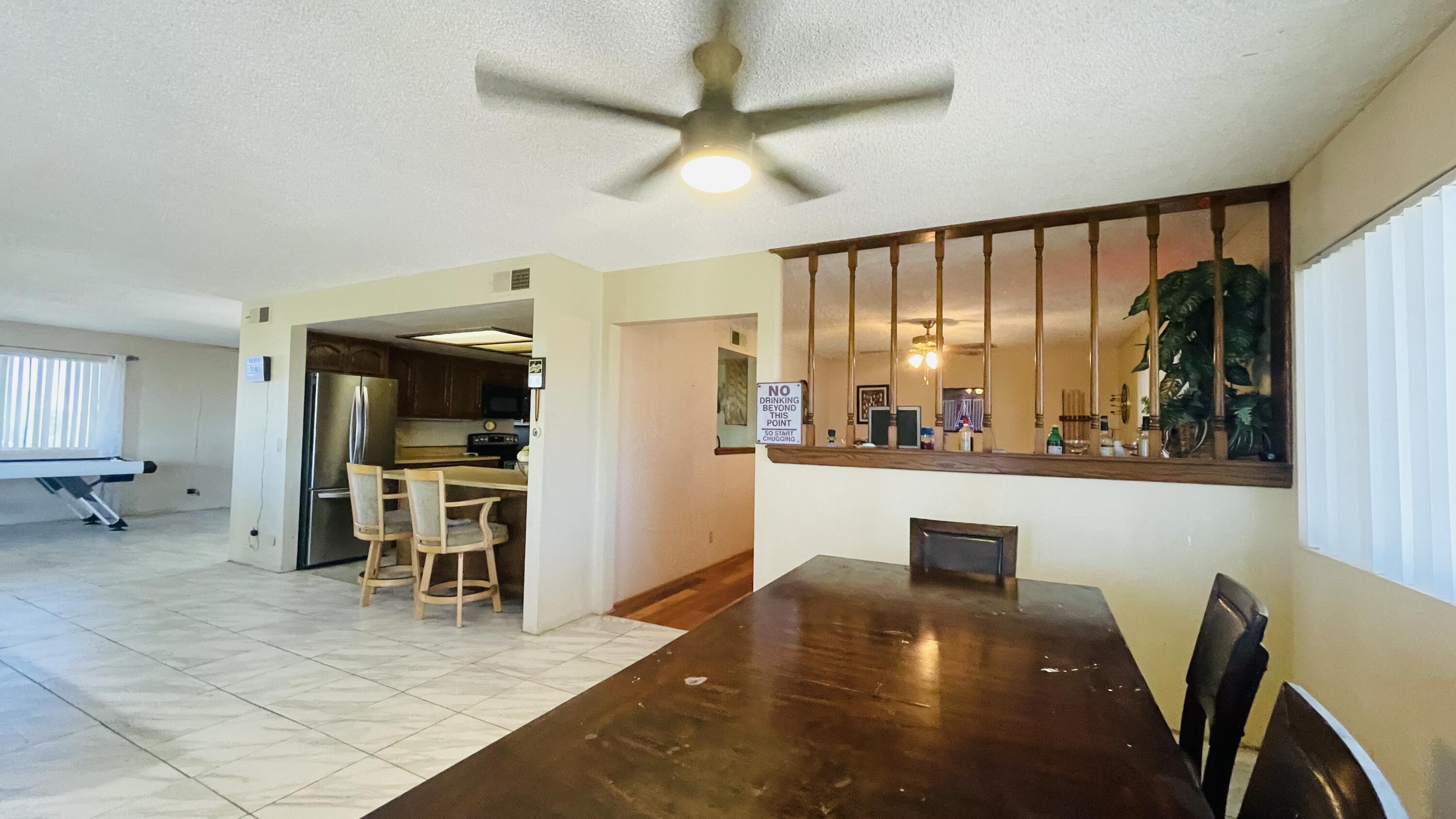 1498 Nile Drive Thermal, CA 92274 - Photo 48 of 108 a living room with furniture a flat screen tv and a large window
