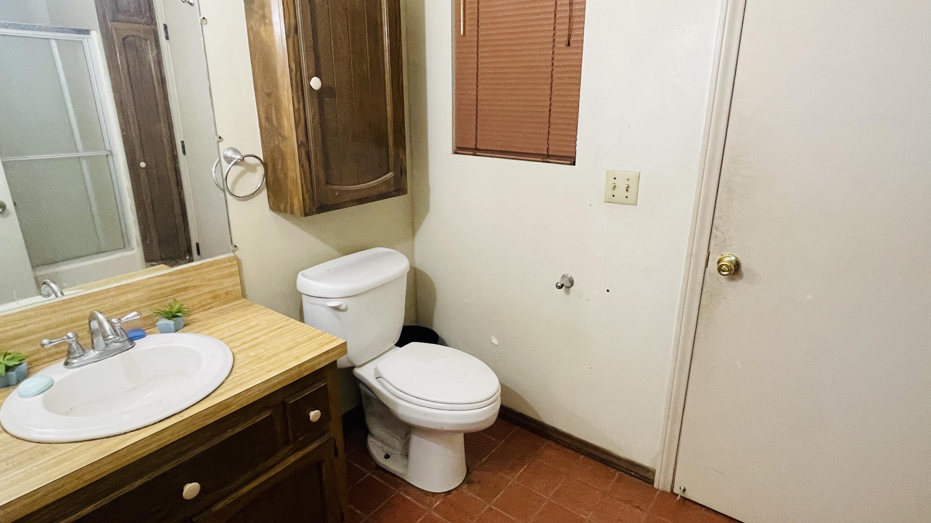 1498 Nile Drive Thermal, CA 92274 - Photo 57 of 108 a bathroom with a granite countertop toilet sink and mirror