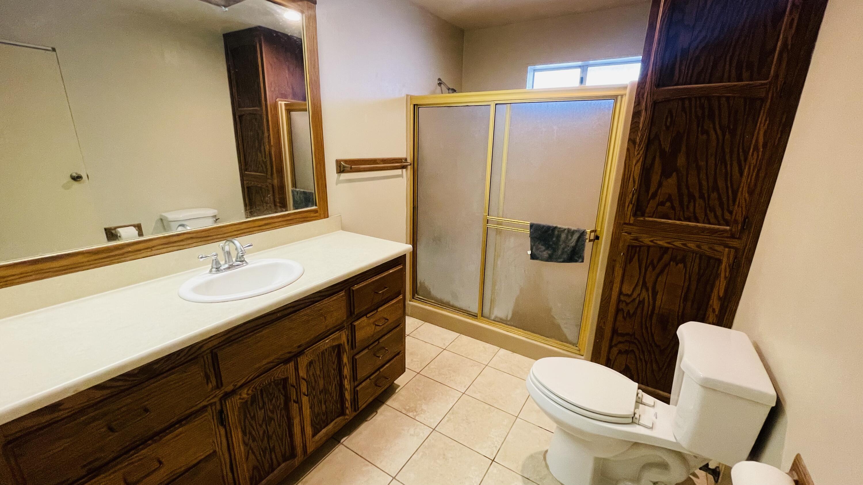 1498 Nile Drive Thermal, CA 92274 - Photo 65 of 108 a bathroom with a sink a toilet a mirror and shower