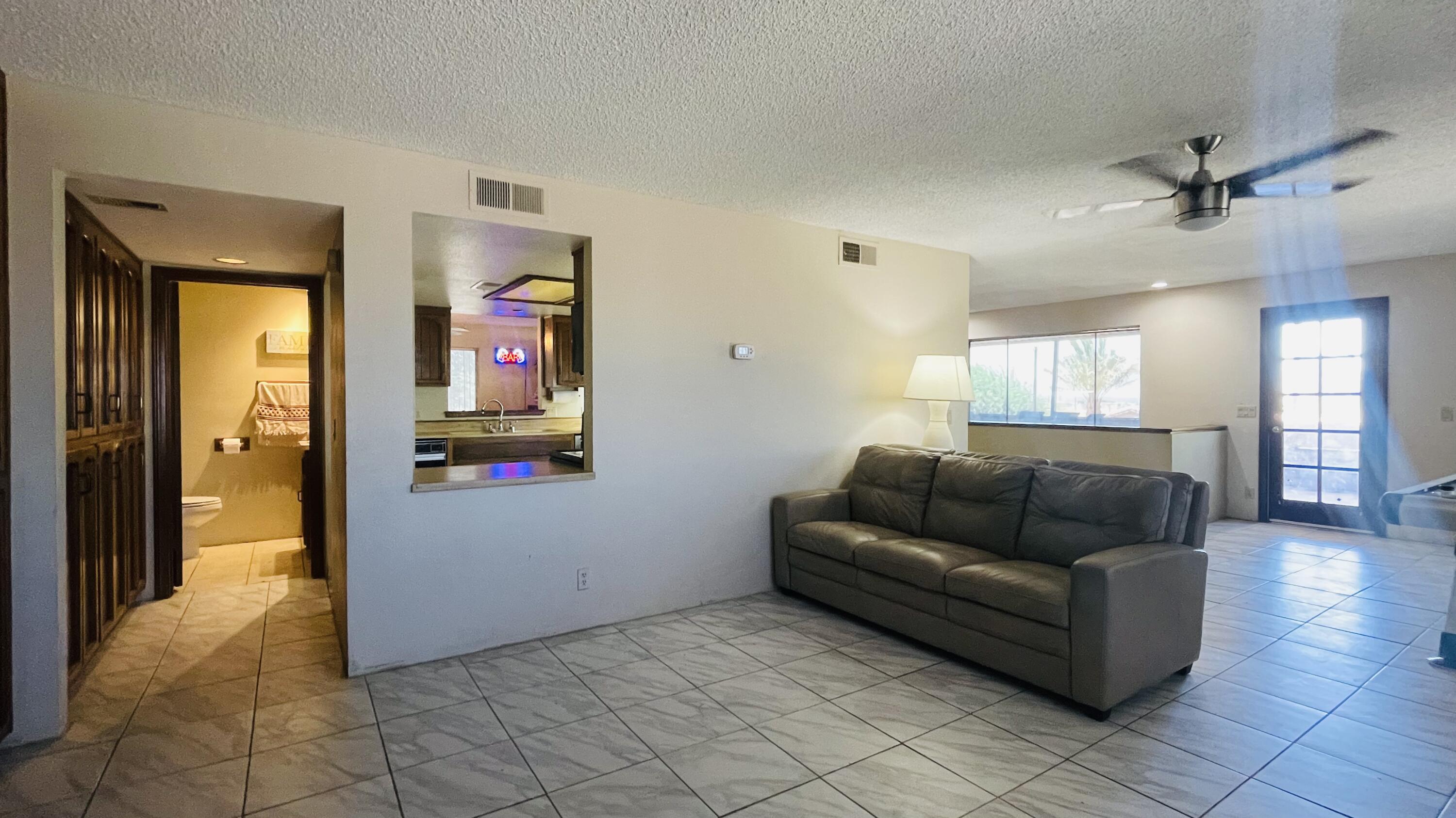 1498 Nile Drive Thermal, CA 92274 - Photo 77 of 108 a living room with furniture and wooden floor