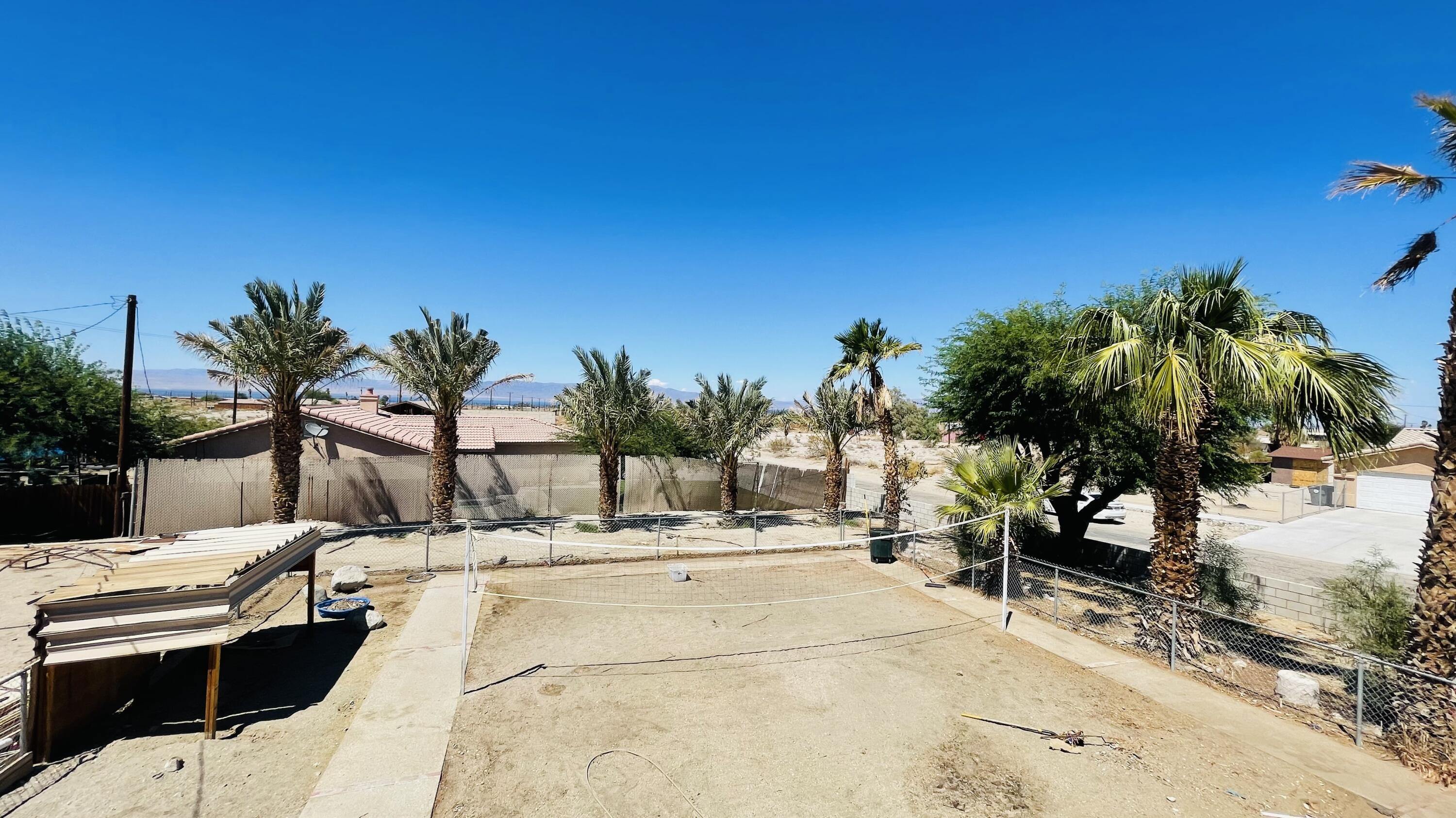 1498 Nile Drive Thermal, CA 92274 - Photo 82 of 108 a swimming pool with outdoor seating and yard